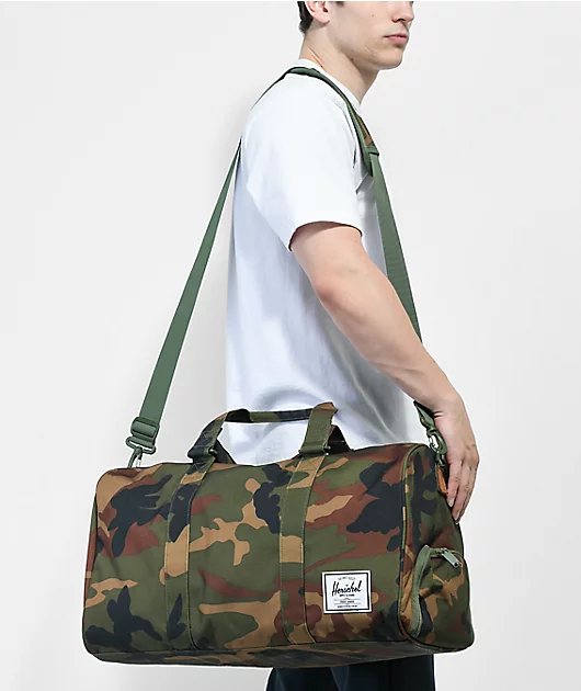62992-herschel-supply-co.-novel-woodland-green-camo-duffel-bag-2.webp Herschel Supply Co. Novel Woodland Green Camo Duffel Bag