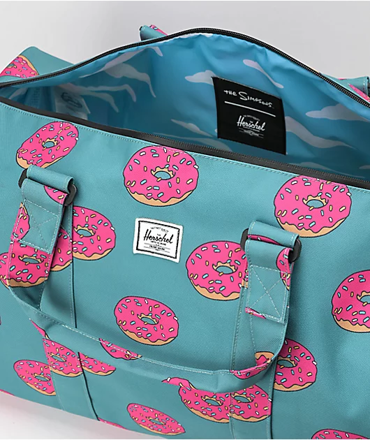 91276-herschel-supply-co.-x-the-simpsons-novel-homer-simpson-blue-duffel-bag-3.webp Herschel Supply Co. x The Simpsons Novel Homer Simpson Blue Duffel Bag